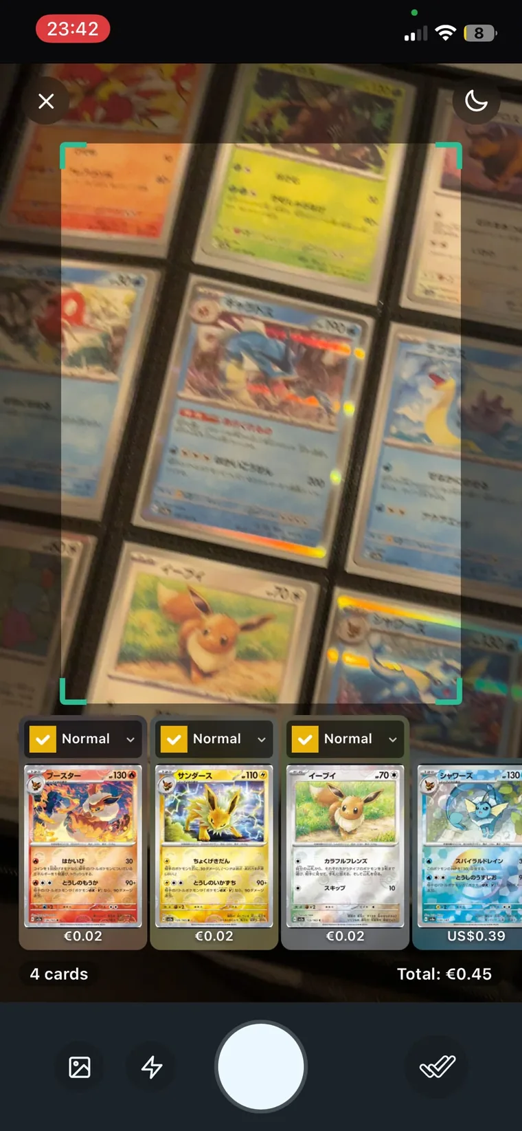 The scanner recognising four Japanese Eeveelution cards at once, with live prices